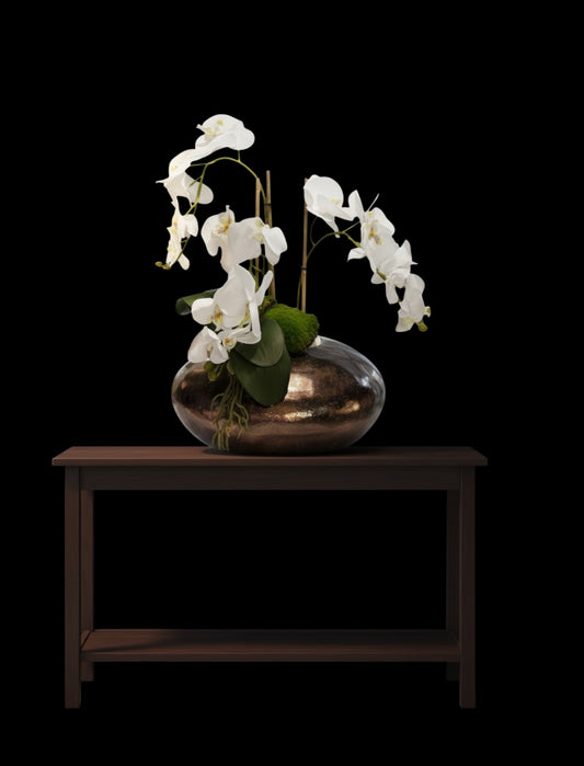 The Florida low white orchid in large bronze vase.